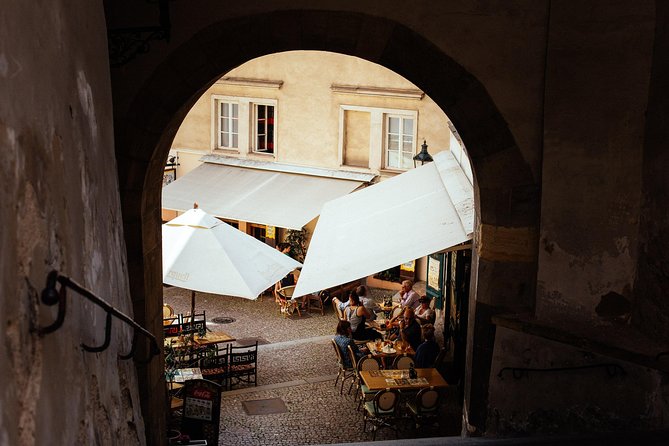 Highlights & Hidden Gems With Locals: Best of Prague Private Walking Tour - Walking down Nerudova Street to Charles Bridge