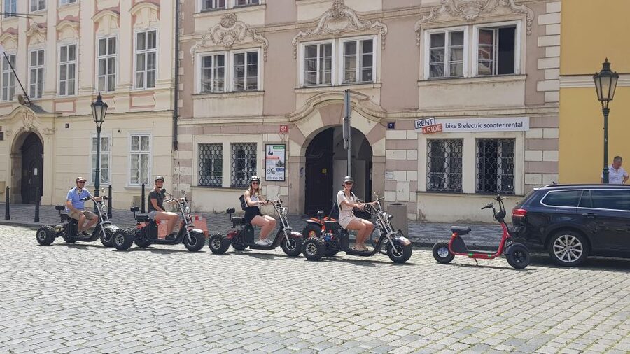 Prague: 2-Hour Trike Live Guided Tour of Old Town - Crossing into Lesser Town and climbing toward the castle