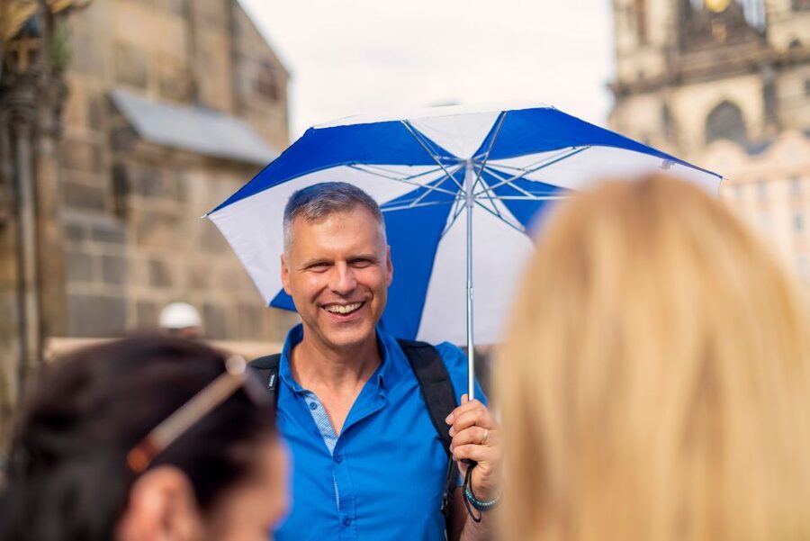 Prague: 6-Hour Tour with River Boat Cruise and Lunch - Crossing Charles Bridge with context