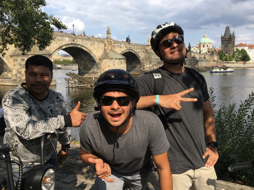 Prague Electric Scooter and eBike Grand Tour - Charles Bridge, the National Theater, and the river