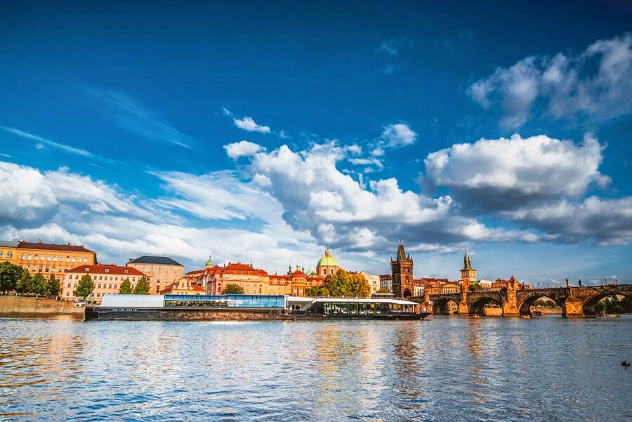 Prague: Vltava River Night Cruise with Buffet - Shared tables and the real dining setup