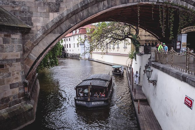 Private Tour: Secret Food Tours Prague - Crossing the Vltava near the Charles Bridge